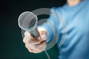 Reporter recording interview with microphone