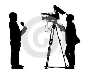 Reporter shooting cameraman silhouette