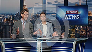 Reporters hosting breaking news at evening tv closeup. Anchors ending broadcast