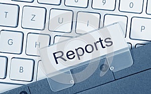 Reports - folder with text on computer keyboard