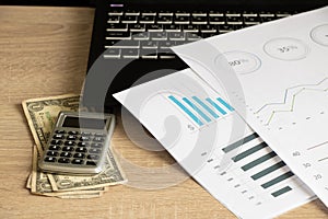 reports and histograms on paper on the table, analytics and statistics on paper, business