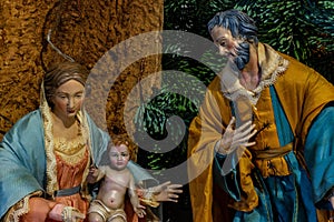 The representation of the holy family, The Virgin Mary holding the Child Jesus and beside St. Joseph.