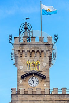 Republic San Marino. National flag on a background of blue sky.