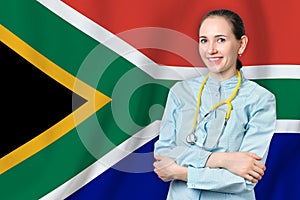 Republic of South Africa healthcare concept with doctor on RSA flag background. Medical insurance, work or study in the country
