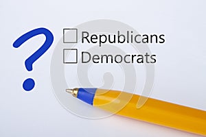 Republicans or Democrats - checkbox with a tick on white paper with yellow pen. Checklist concept photo