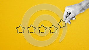 Reputation management. Customer Experience Concept. Woman hand puts five star excellent rating, copy space