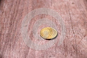 REPVBBLICA ITALIANA, Aluminium-Bronze Coin of Italy on the wooden floor.