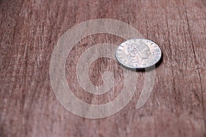 REPVBBLICA ITALIANA, Coin of Italy on the wooden floor, 50 Lire photo