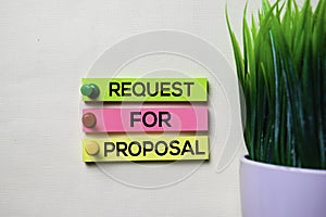 Request For Proposal text on sticky notes isolated on office desk photo