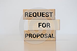 Request for proposal written on wood block on white background