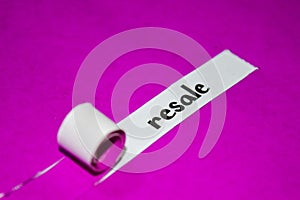 Resale text, Inspiration, Motivation and business concept on purple torn paper photo