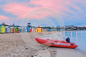 Rescue boat on a beach with huts