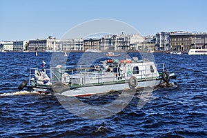 A rescue boat for divers floats down the river, the water blocks the water line