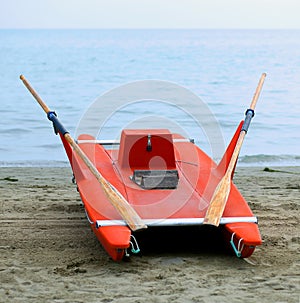 Rescue boat rowing for lifeguard on the shore of the sea