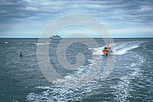 Rescue boat sailing in a dark blue sea