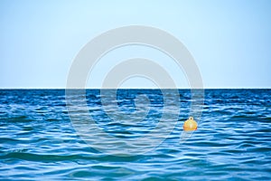 Rescue buoy floats on waves in sea water