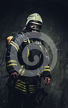 Rescue firefighter in safe helmet and uniform.