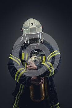 Rescue firefighter in safe helmet and uniform.