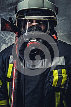 Rescue firefighter in safe helmet and uniform.