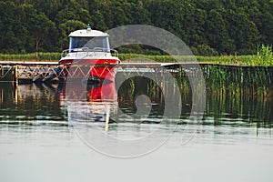 Rescue guard motor boat dock at old wooden pier