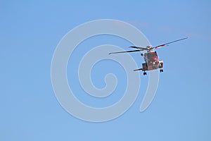 Rescue helicopter in clear blue sky