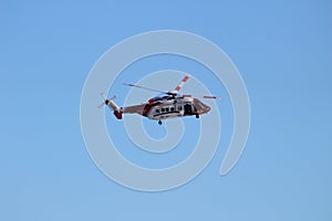 Rescue helicopter in clear blue sky
