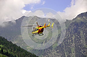 Rescue helicopter in the mountains photo