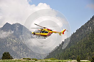 Rescue helicopter in the mountains photo