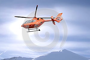 Rescue helicopter over mountain summits photo