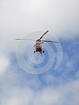 rescue helicopter during a rescue operation in the tatra mountains