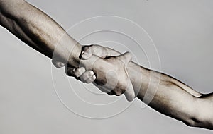 Rescue, helping gesture or hands. Strong hold. Two hands, helping hand of a friend. Handshake, arms, friendship photo