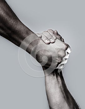 Rescue, helping hand. Two hands, helping hand of a friend. Black and white. Man help hands, guardianship, protection
