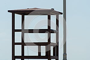 rescue hut on a sandy beach, safe relax by the ocean, a beautiful sunny day