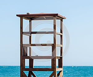 rescue hut on a sandy beach, safe relax by the ocean, a beautiful sunny day