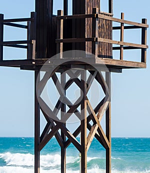 rescue hut on a sandy beach, safe relax by the ocean, a beautiful sunny day