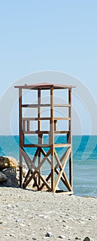 rescue hut on a sandy beach, safe relax by the ocean, a beautiful sunny day