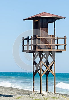 rescue hut on a sandy beach, safe relax by the ocean, a beautiful sunny day