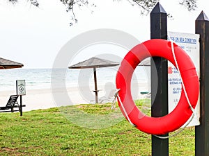 Rescue lifebuoy hang on the information board by the beach.