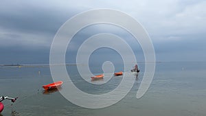 Rescue operation at sea. Rescue expedition. The boat tows several boats into the sea.