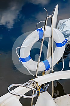 Rescue red lifebuoy life ring on boat