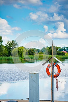 Rescue red lifebuoy life ring in port