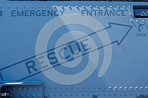 Rescue Sign on grey background with rivets