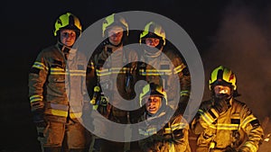 Rescue Team of Firefighters in front of the fire. Firefighter training for emergency