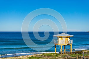 Rescue tower on the beach with blue ocean view