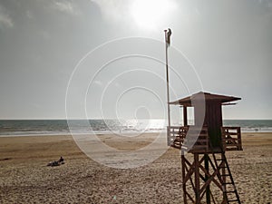 Rescue tower at sunset on a beach