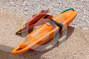 Rescue tube with two flippers on a beach promenade