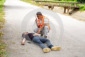 A rescue workers using radio communication calling for help team for help a man