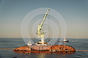 Rescue wrecked oil tanker Delfi in Odessa, Ukraine 26 August 2020, near Black Sea coast. Marine Crane lift wreck Delphi into sea.