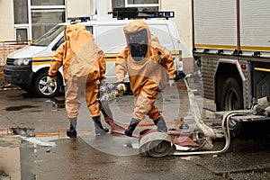 Rescuers in capsule suits at special equipment photo