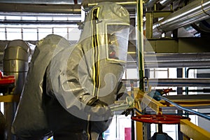 Rescuers in a radiation protection suit